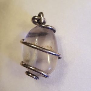 Clear stone wrapped in silver